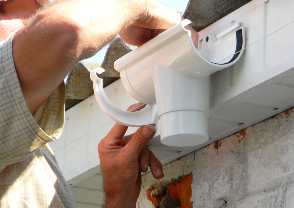 Man repairing a gutter