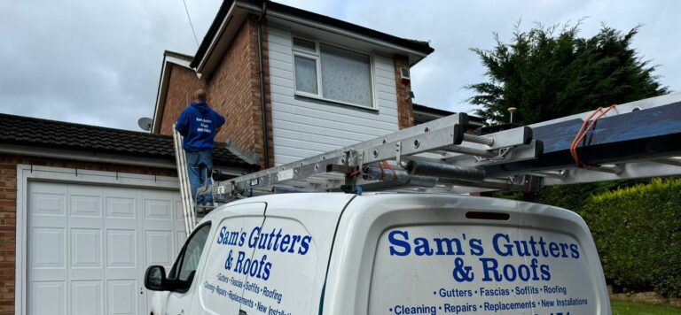 Roofer inspecting the roof